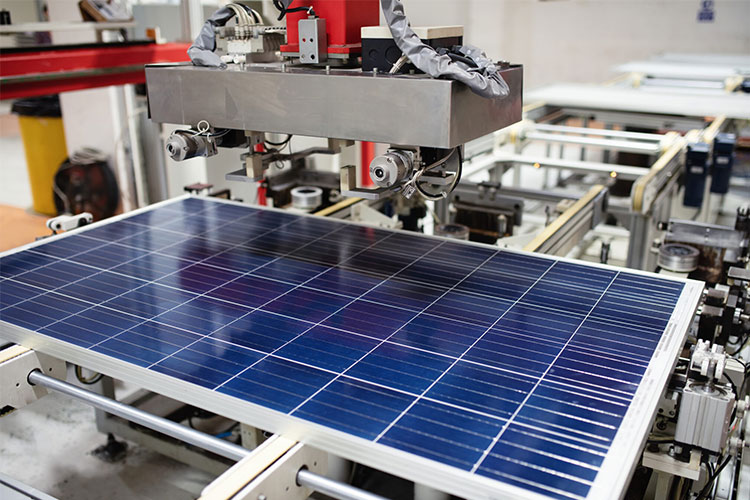 Manufacturing of solar panel system in factory.