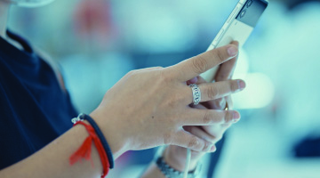 Woman typing on mobile phone