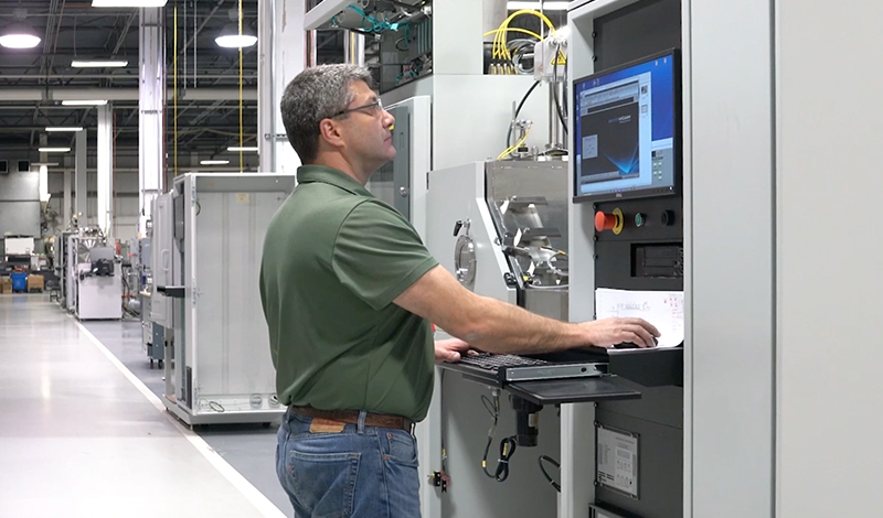 A man working on a system at Denton Vacuum